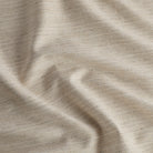 Chester Flax high-performance upholstery fabric by Tonic Living — a versatile neutral with a subtle herringbone pattern.