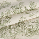 Tonic Living Colette Forest Green fabric for drapery and Roman shades featuring a classic French toile pattern.