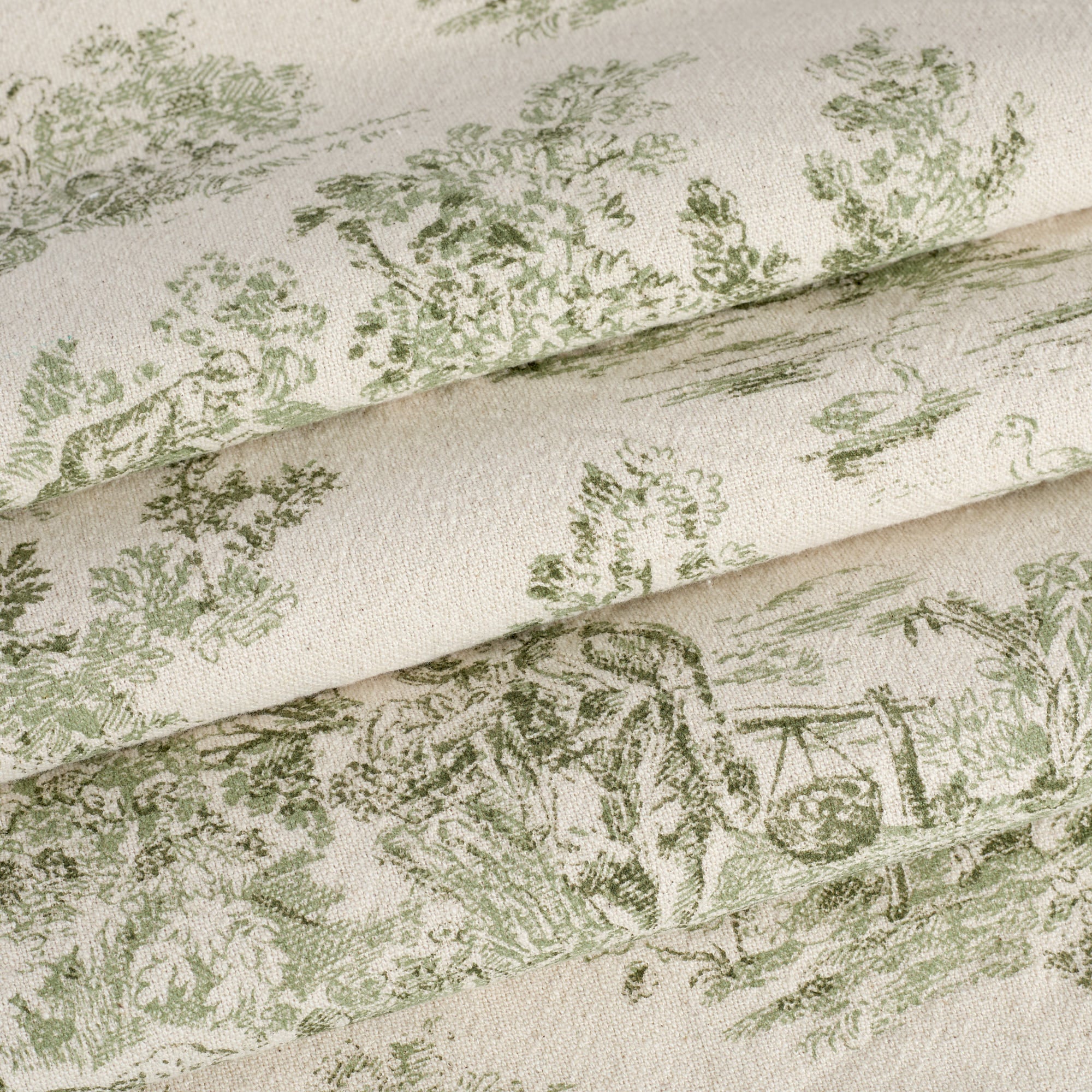 Tonic Living Colette Forest Green fabric for drapery and Roman shades featuring a classic French toile pattern.