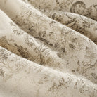 Close up of Tonic Living Colette Portobello fabric showing scenic toile detail in portobello brown and natural.
