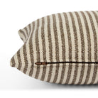 Side zipper detail of Tonic Living Crosby Stripe 14x20 lumbar cushion in brown and beige stripes.