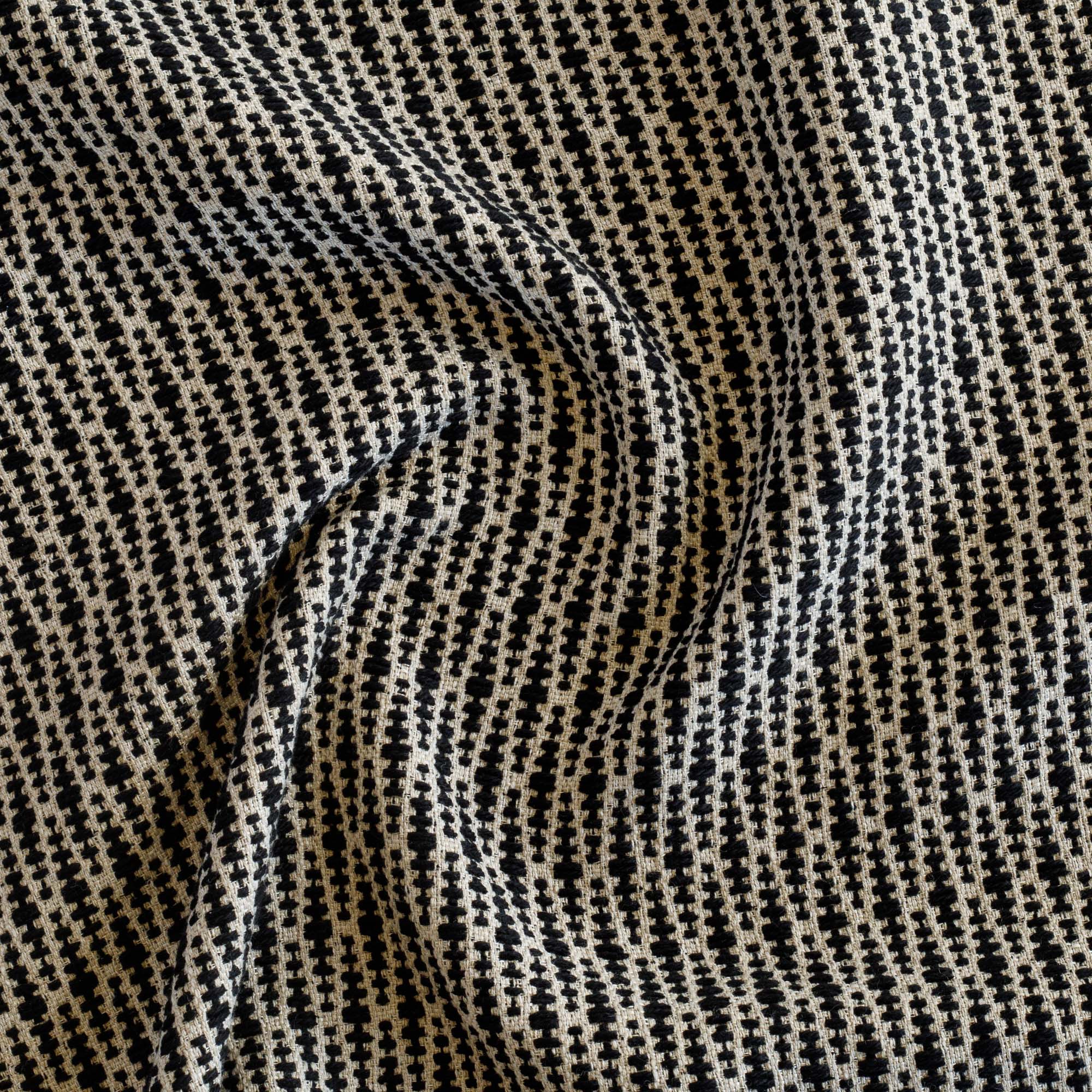 a black and tan textured geometric patterned multipurpose fabric 