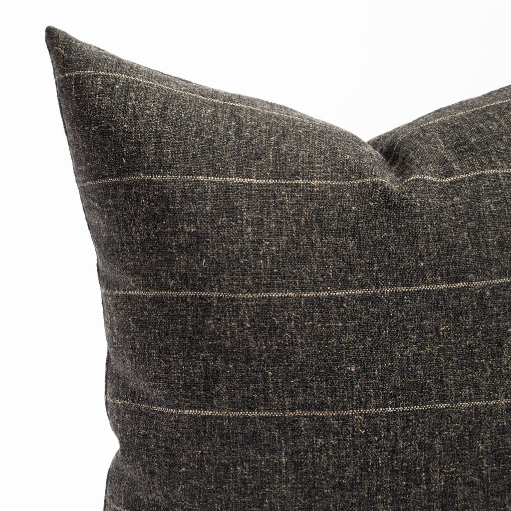 a charcoal grey with a fine beige horizontal stripe throw pillow : close up view