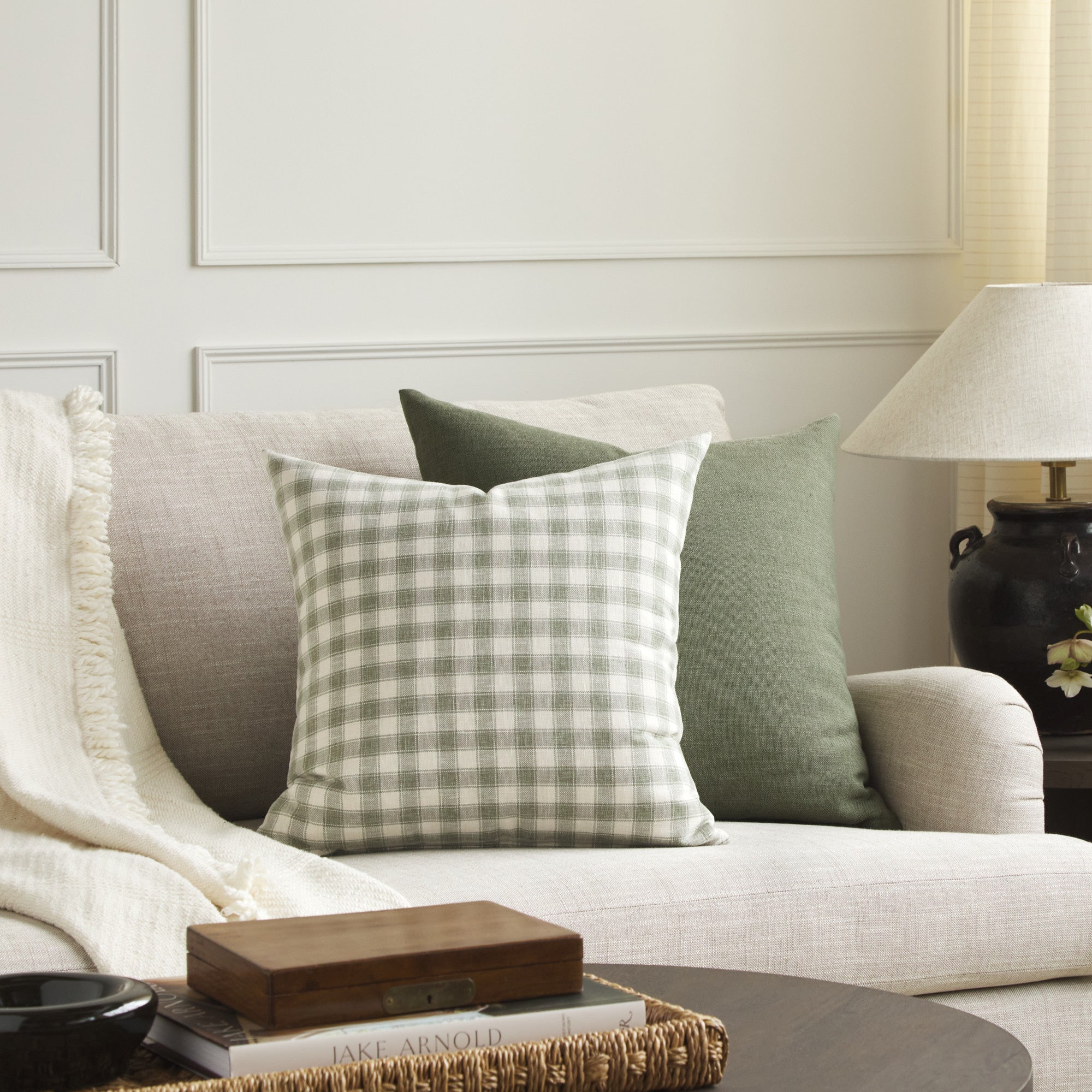Tonic Living Emmett Plaid sage throw pillow paired with the Loden 22x22 cushion in sage green.