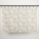 Full yard of Tonic Living Fable Fabric in Meadow hanging to show the scale and drape of its multicolour botanical pattern.