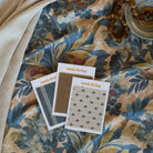 Juno Fabric, Navy by Tonic Living — shown with coordinating fabric swatches in complementary patterns and colors.