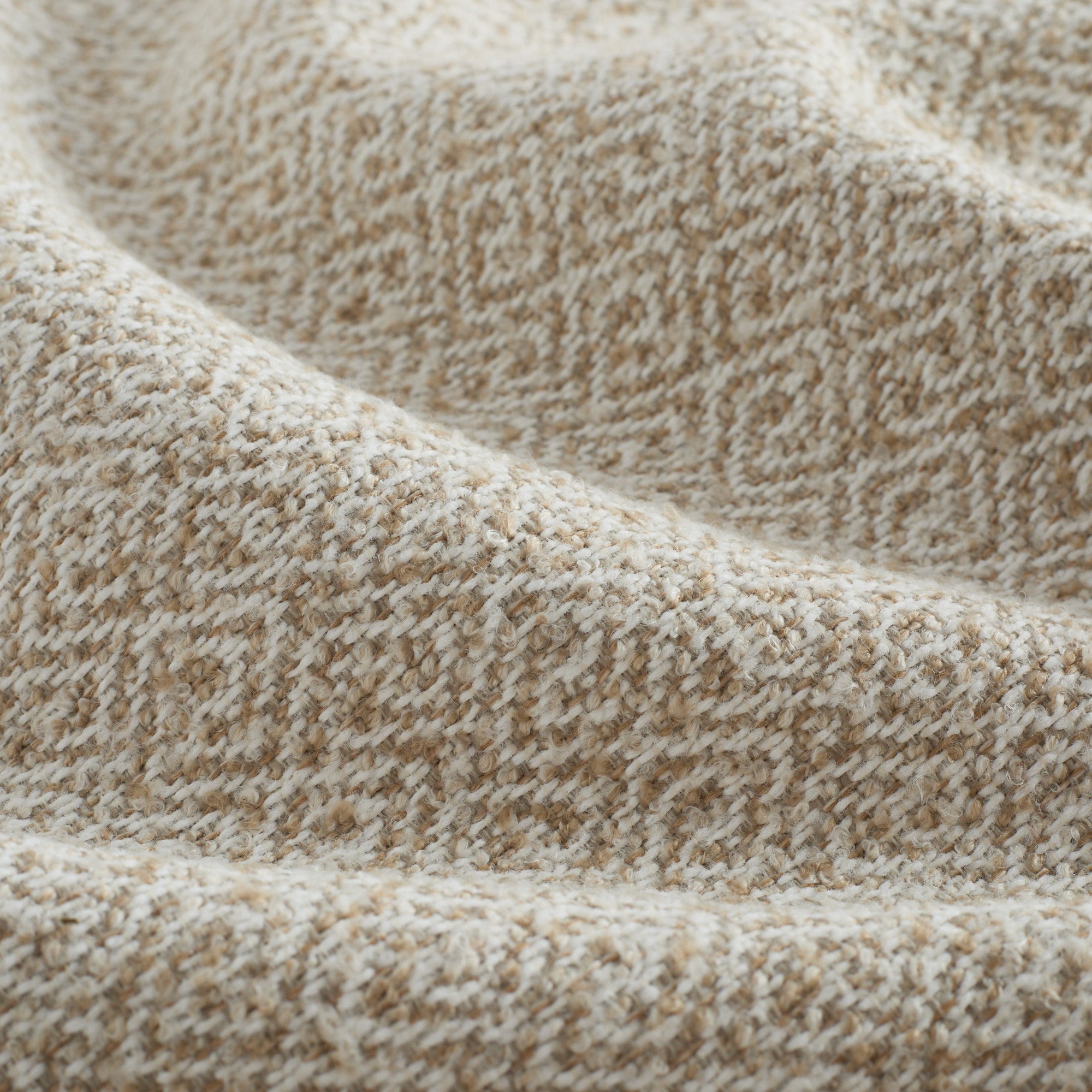 Close-up of Chester Wheat Fabric by Tonic Living – textural diamond pattern upholstery fabric in warm beige.