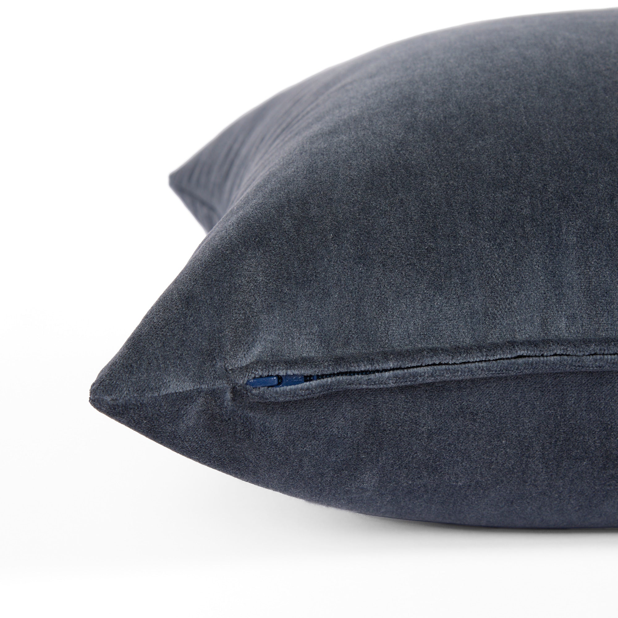 Side zipper detail of Tonic Living Florence Velvet 20x20 pillow in Mineral Blue.