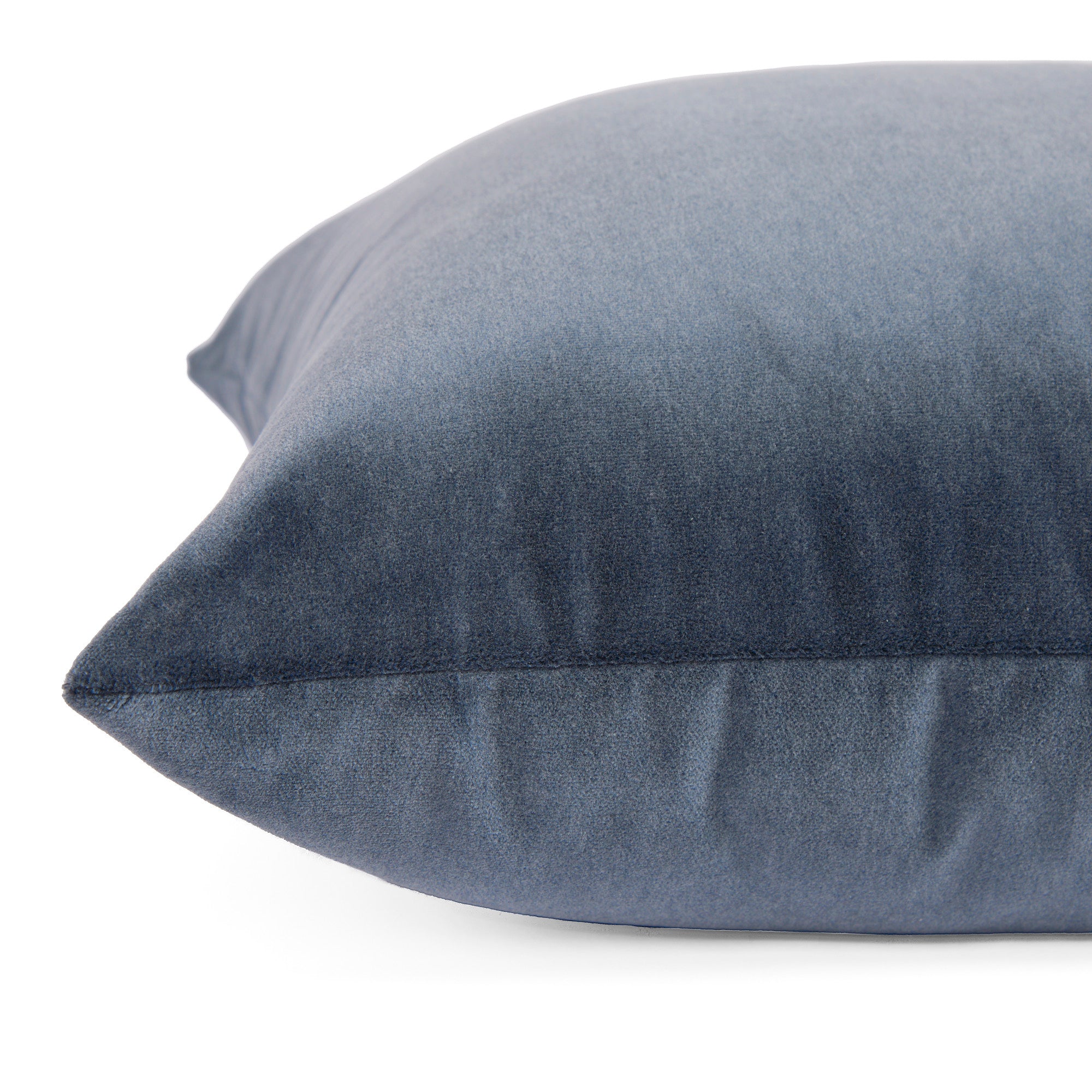 Side zipper detail of Tonic Living Florence Velvet 20x20 pillow in Mineral Blue.