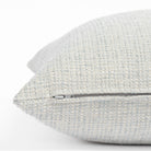 a sky blue textured outdoor throw pillow : close up zipper view