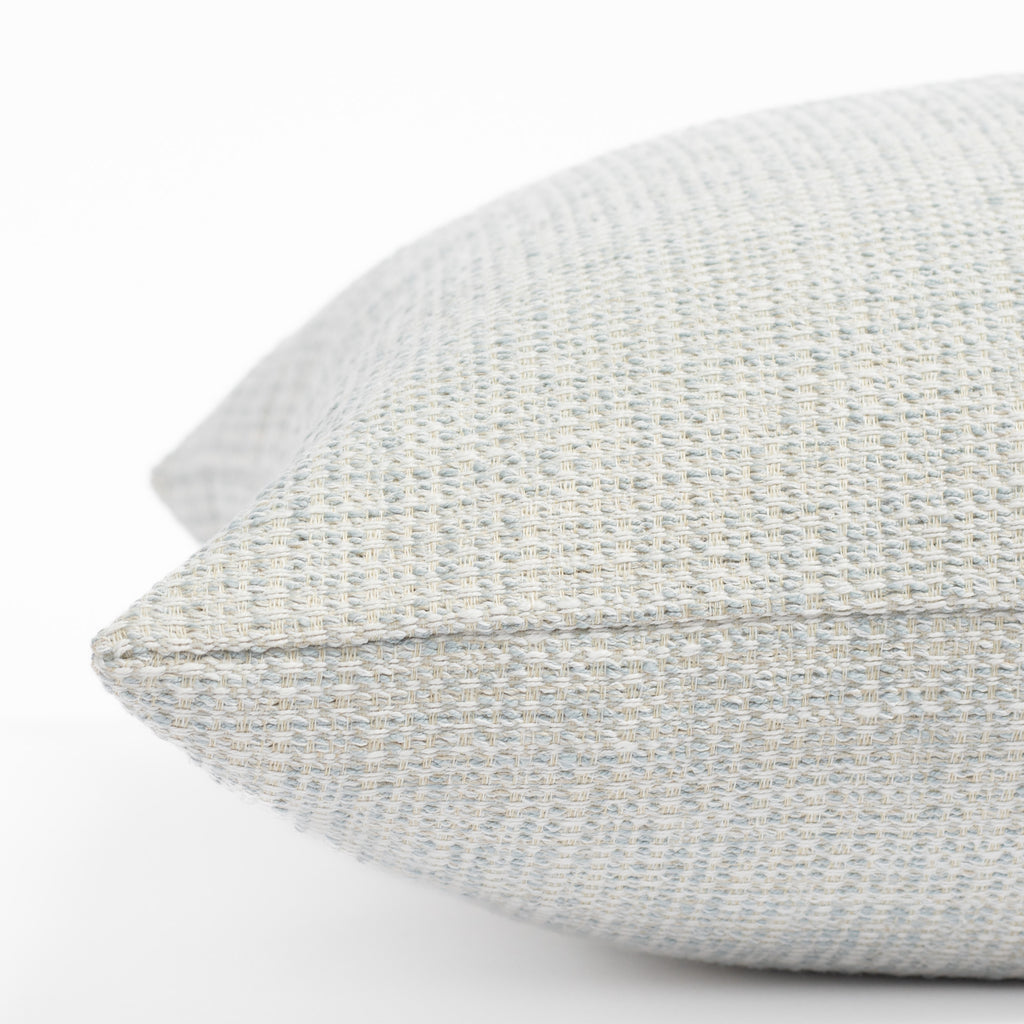 a sky blue textured outdoor throw pillow : close up side view