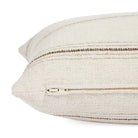 Side zipper detail of Tonic Living Gibson Stripe 14x20 lumbar pillow in classic beige and brown stripes.