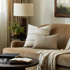 Tonic Living Gibson Stripe Birch decorative pillow styled on a sofa with a coordinating neutral striped lumbar cushion.