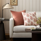 Two pink toned Tonic Living throw pillows styled on a sofa: Florence Velvet Rosewood and Grace Rosewood