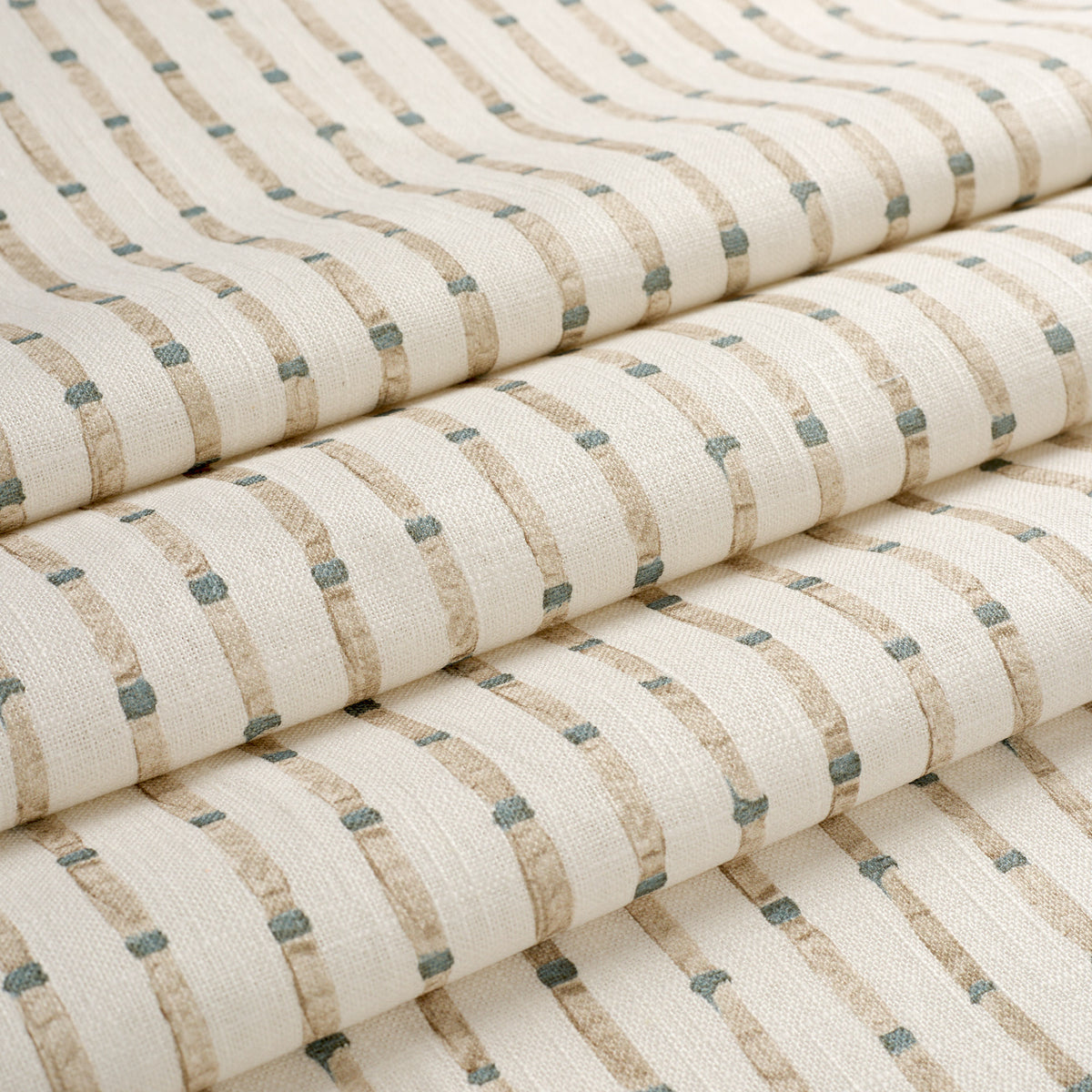 Tonic Living Hadley Stripe Fabric shown in soft folds like a Roman shade, featuring a blue and brown bamboo-inspired stripe.