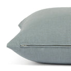 Side zipper detail of Tonic Living Hampton 22x22 throw pillow in soft chambray blue.
