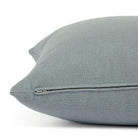 Side zipper detail of Tonic Living Hampton 24x24 throw pillow in chambray blue.