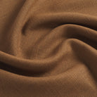 Tonic Living Hampton Cinnamon performance upholstery fabric featuring a linen-inspired texture and rich cinnamon brown colour.