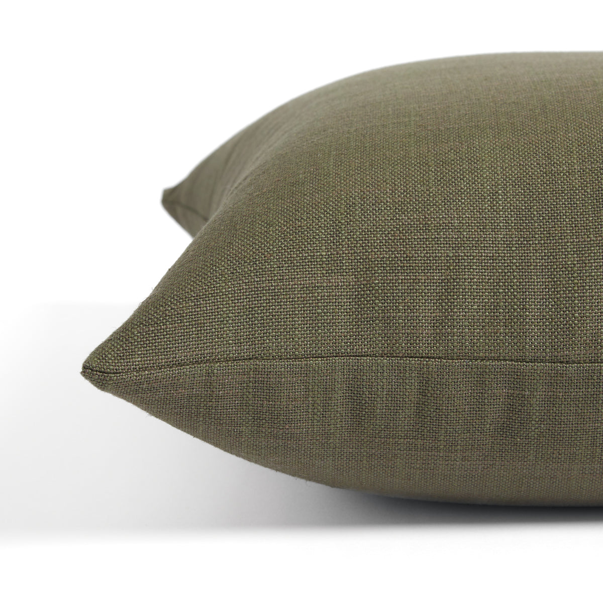 Side view of Tonic Living Hampton Moss toss cushion highlighting its rich earthy green colour and linen-look texture.