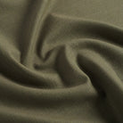 Tonic Living Hampton Moss performance upholstery fabric featuring a linen-inspired texture and earthy green colour.