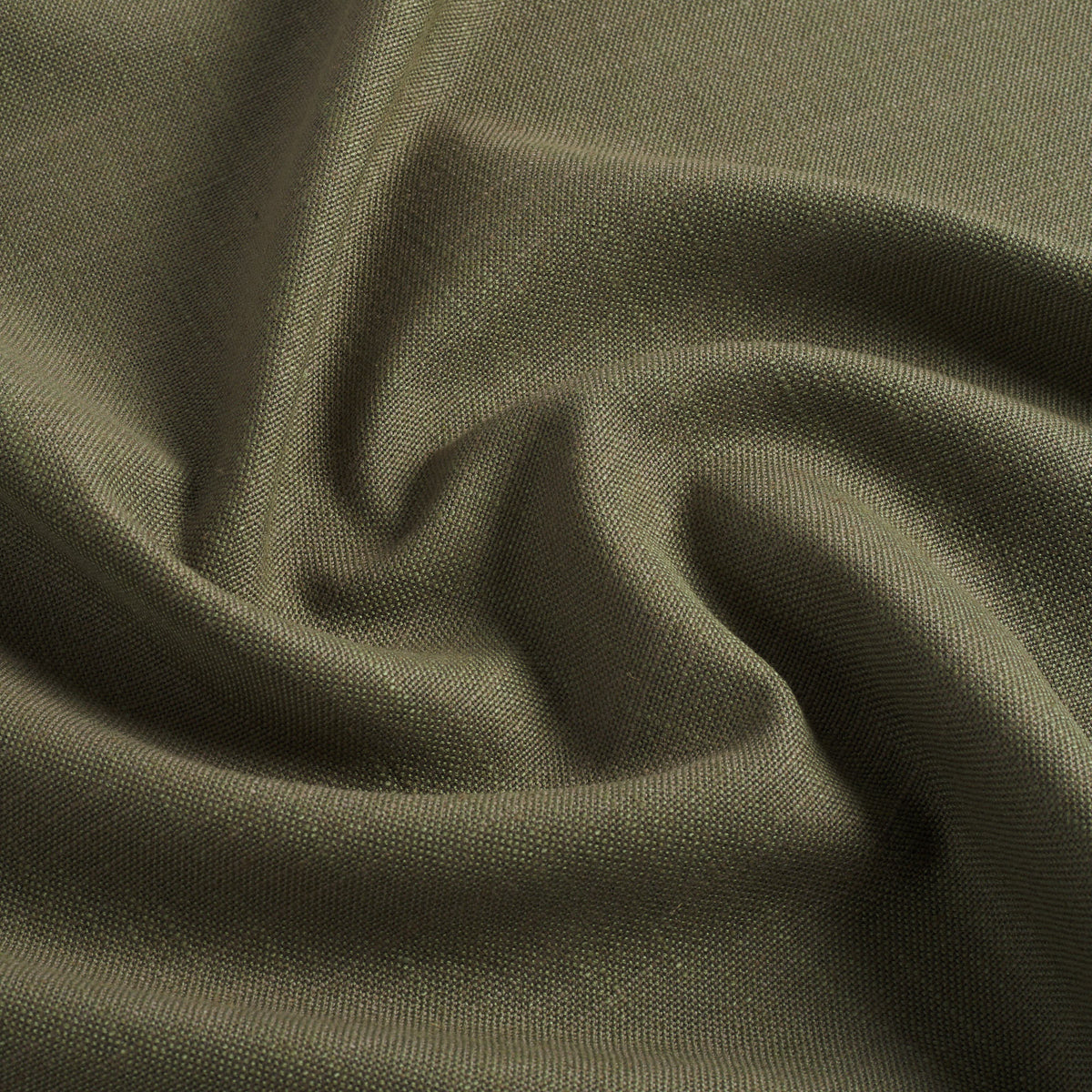 Tonic Living Hampton Moss performance upholstery fabric featuring a linen-inspired texture and earthy green colour.