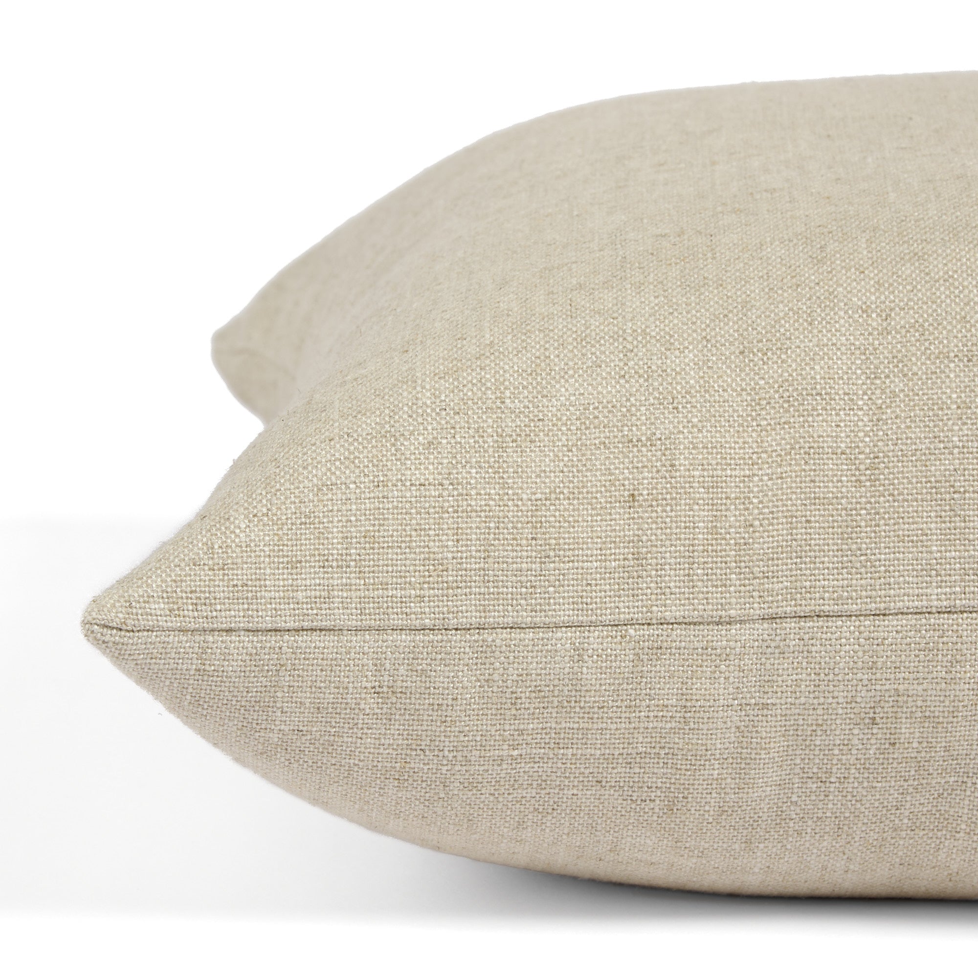 Side view of Tonic Living Hampton Oatmeal decorative pillow highlighting its warm neutral Belgian linen look.