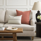 Tonic Living Hampton Rosewood decorative pillow styled on a sofa with a neutral beige and brown Gibson Stripe lumbar cushion.