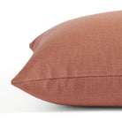 Side view of Tonic Living Hampton Rosewood toss cushion highlighting its warm pink terracotta colour and linen-look texture.