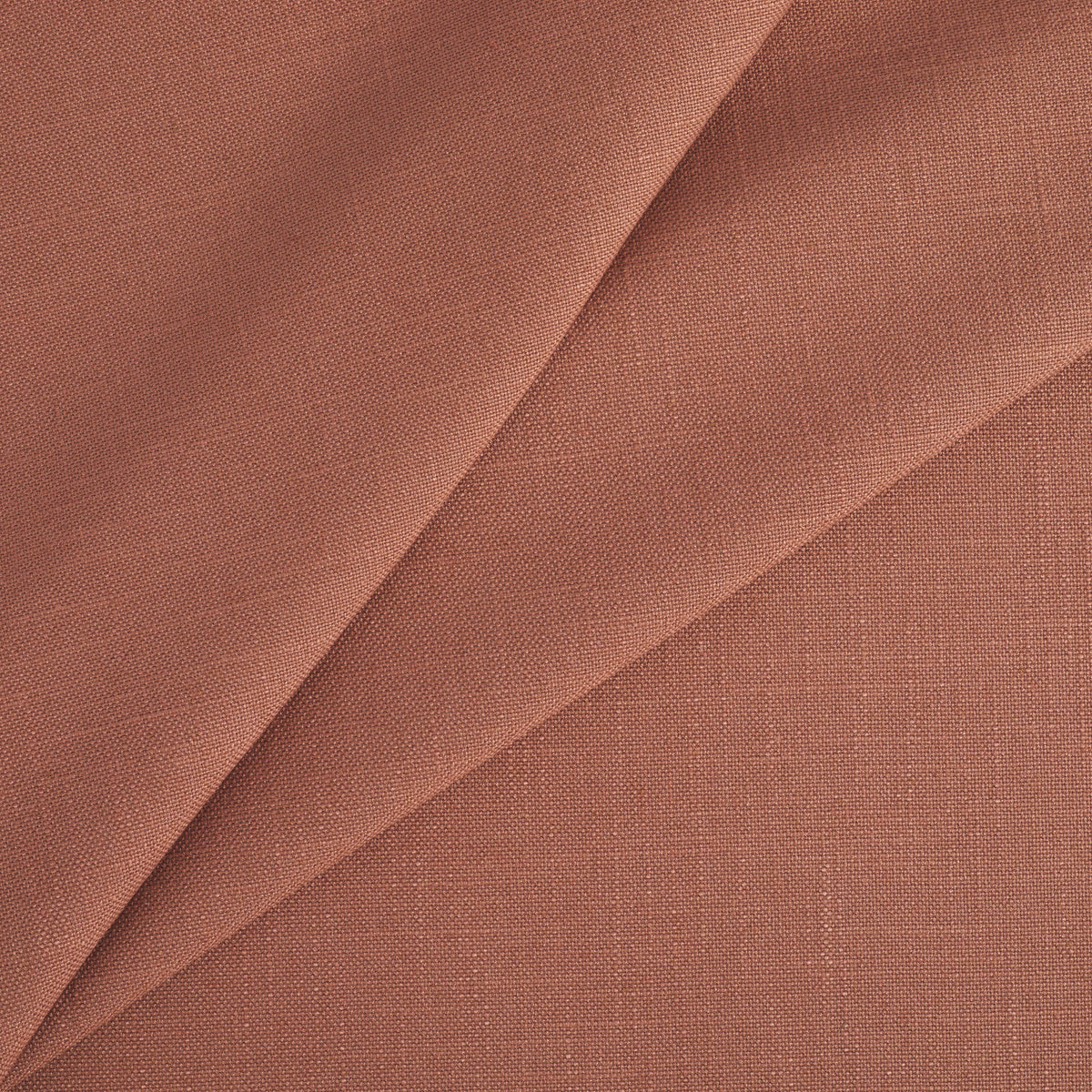 Tonic Living Hampton Fabric in Rosewood, a durable rose terracotta upholstery fabric with a soft woven texture and Belgian linen look.