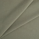 Tonic Living Hampton Sage upholstery fabric featuring a muted green tone with Belgian linen look and feel.