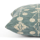 Side view of Tonic Living Hazel Pool decorative cushion highlighting its blue-green and beige floral pattern.