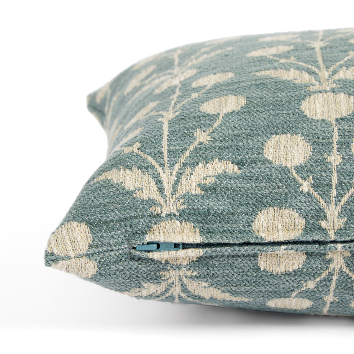 Side zipper detail of Tonic Living Hazel 14x20 lumbar pillow featuring a muted teal blue and oatmeal botanical pattern.