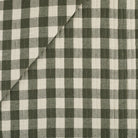 Tonic Living Henry Check Forest Green matelassé fabric with a timeless green and beige check pattern.