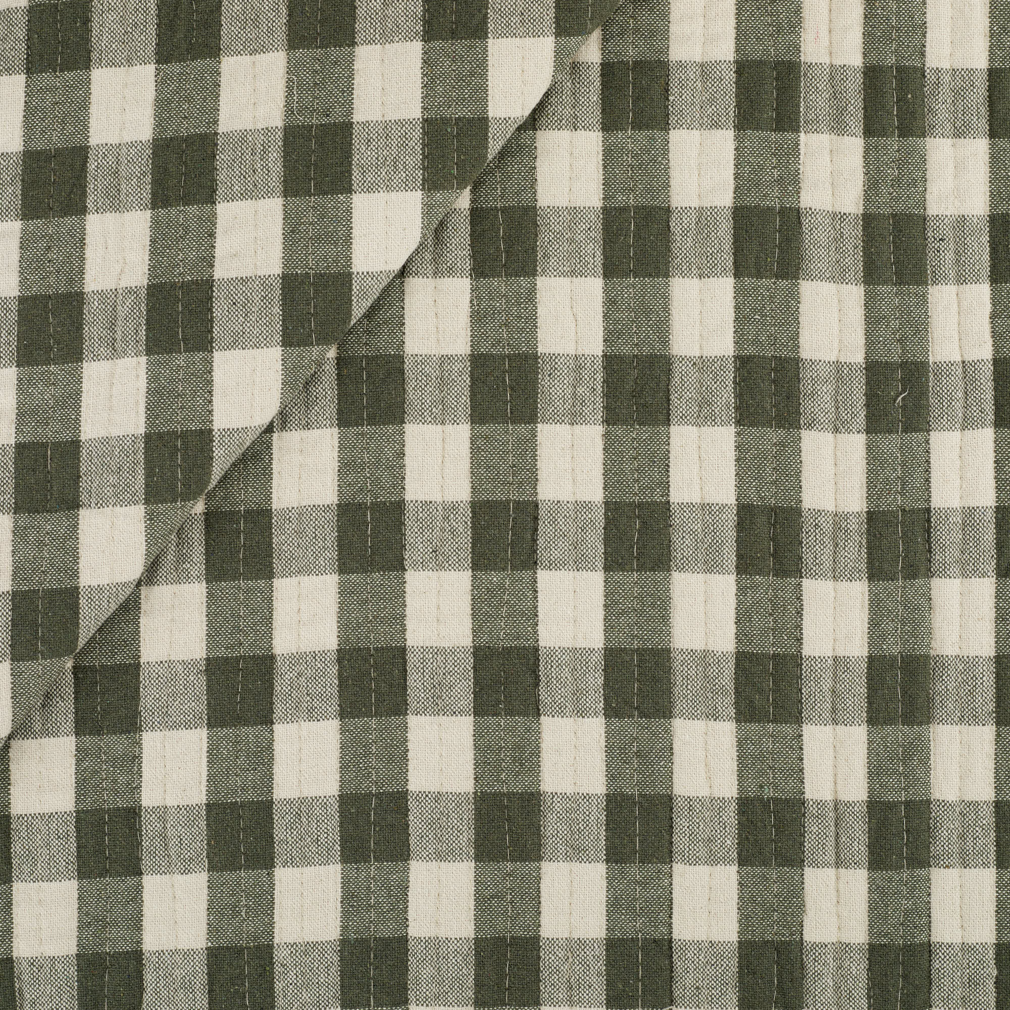 Tonic Living Henry Check Forest Green matelassé fabric with a timeless green and beige check pattern.