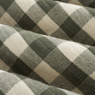 Close up of Tonic Living Henry Check Forest Green fabric showing quilted texture and gingham check detail.