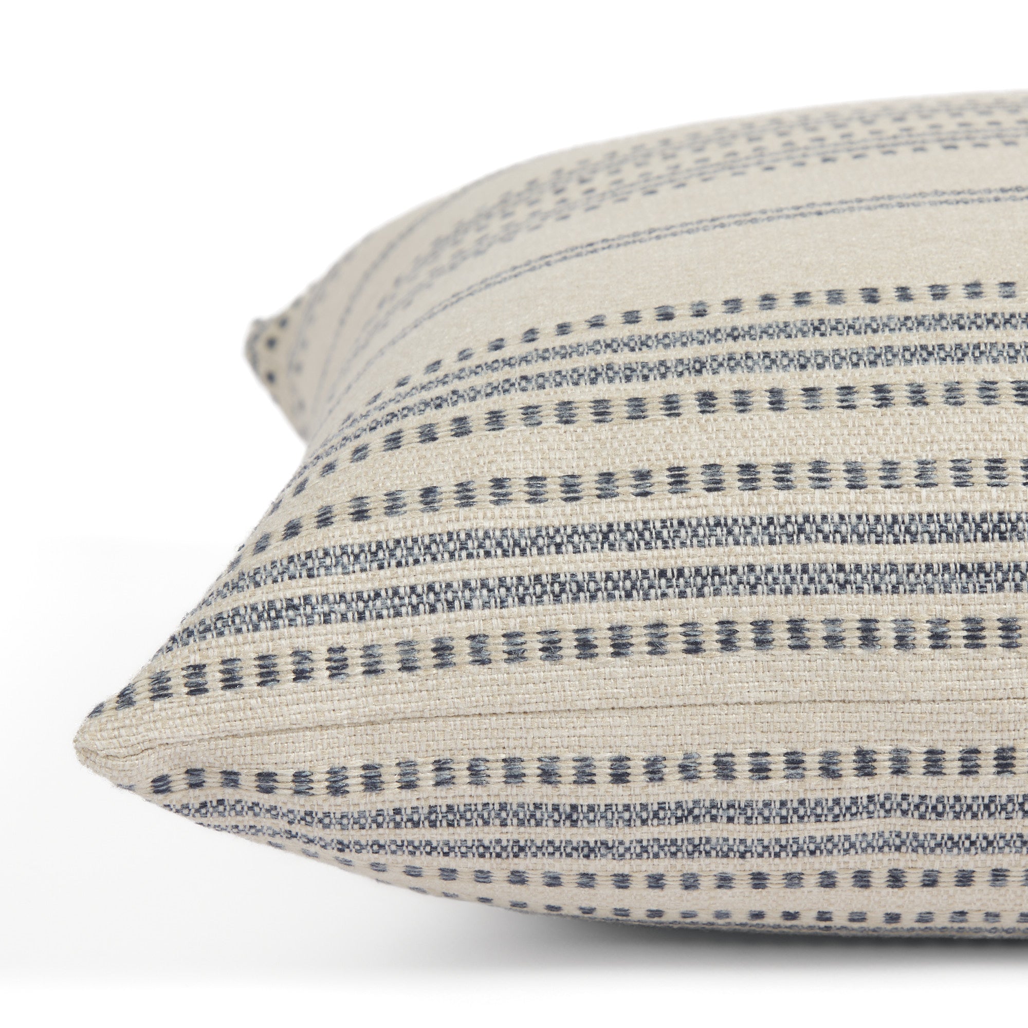 Side view of Tonic Living Hopper Stripe decorative cushion highlighting its textured layered stripe design.