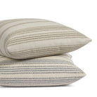 Tonic Living Hopper Stripe throw pillows in Denim and Toffee stacked together, featuring layered stripe designs in blue and brown tones.