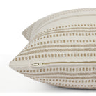 Side zipper detail of Tonic Living Hopper Stripe 22x22 toss cushion in a neutral oatmeal and brown stripe.