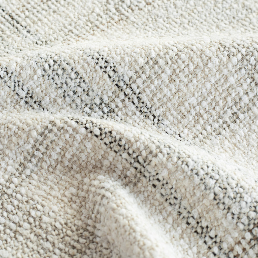 a cream and grey upholstery fabric - close up view