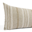 Close up of Tonic Living Indie Stripe bed bolster showing sand, taupe, oatmeal, and warm white stripes.
