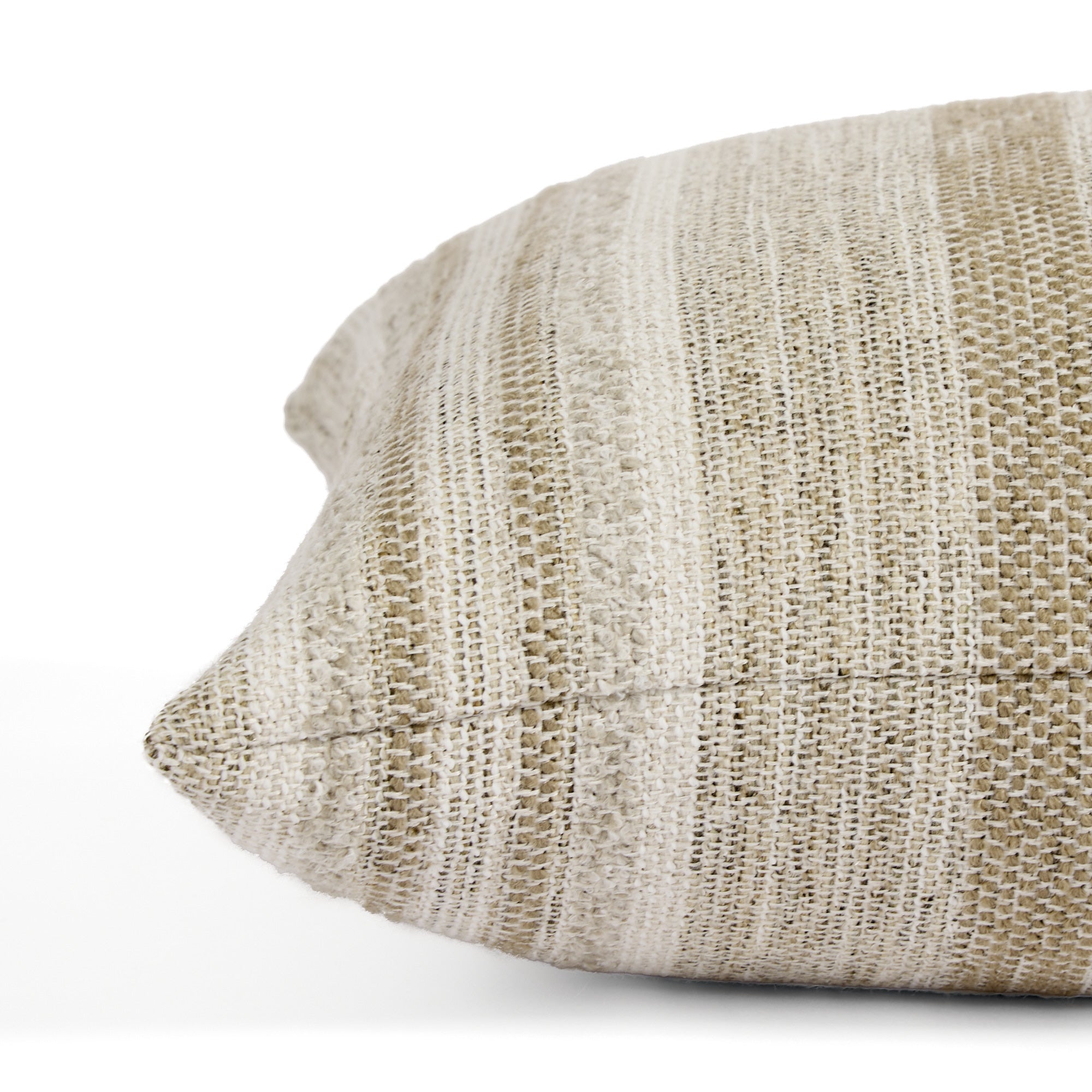 Side view of Tonic Living Indie Stripe extra long lumbar pillow highlighting its layered neutral stripe texture.