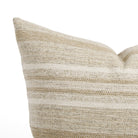 Close up of Tonic Living Indie Stripe pillow showing sand, taupe, oatmeal, and warm white stripes.