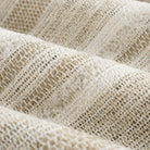 Close up of Tonic Living Indie Stripe Sand high-performance fabric showing sand, taupe, oatmeal, and warm white stripes.