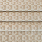 a cream and beige brown checkboard, sun motif patterned home decor  upholstery fabric from Tonic Living 