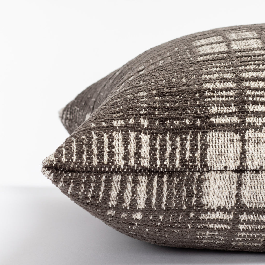 a charcoal grey and beige chenille textured plaid throw pillow : close up side view