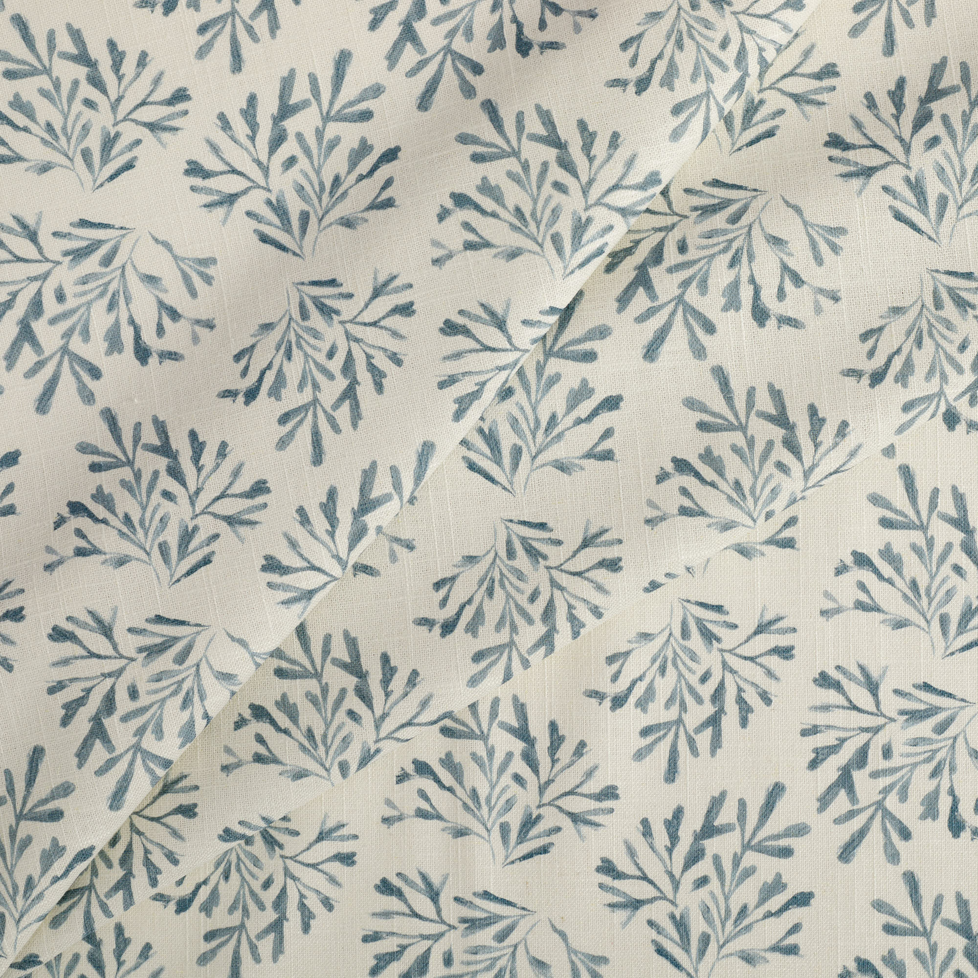 Tonic Living Juniper Harbour Blue drapery fabric featuring a delicate botanical vine and sprig design.