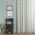 Tonic Living Juniper Harbour Blue curtain fabric shown as full drapery in a blue room with classic decor.