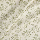 Tonic Living Juniper Sage drapery fabric featuring a delicate botanical vine and sprig design.