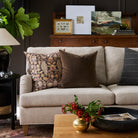 Living room with Kalida Walnut botanical print and Valentina Velvet dark brown pillows styled on a sofa – Tonic Living