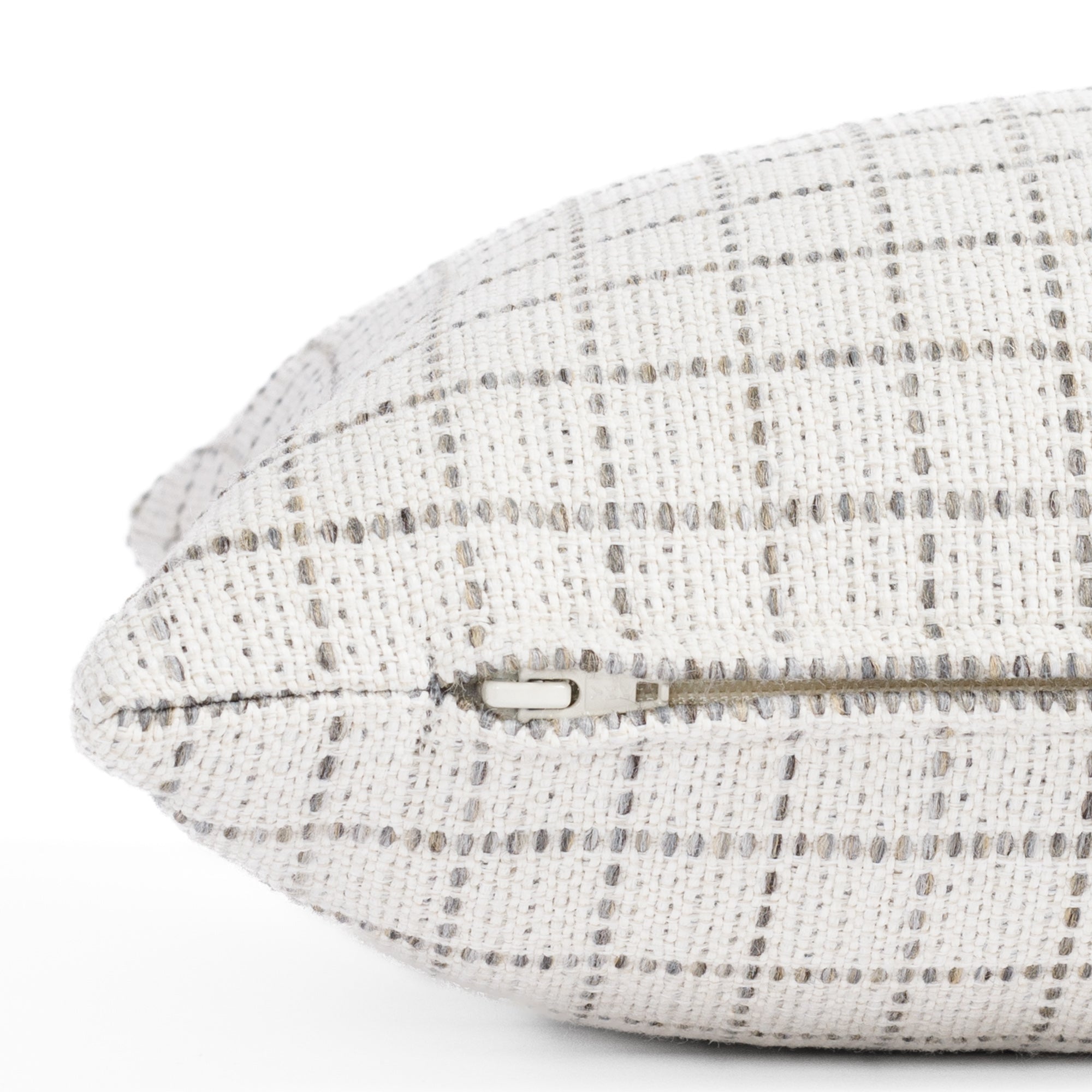a cream and grey windowpane check pattern lumbar pillow : zipper detail